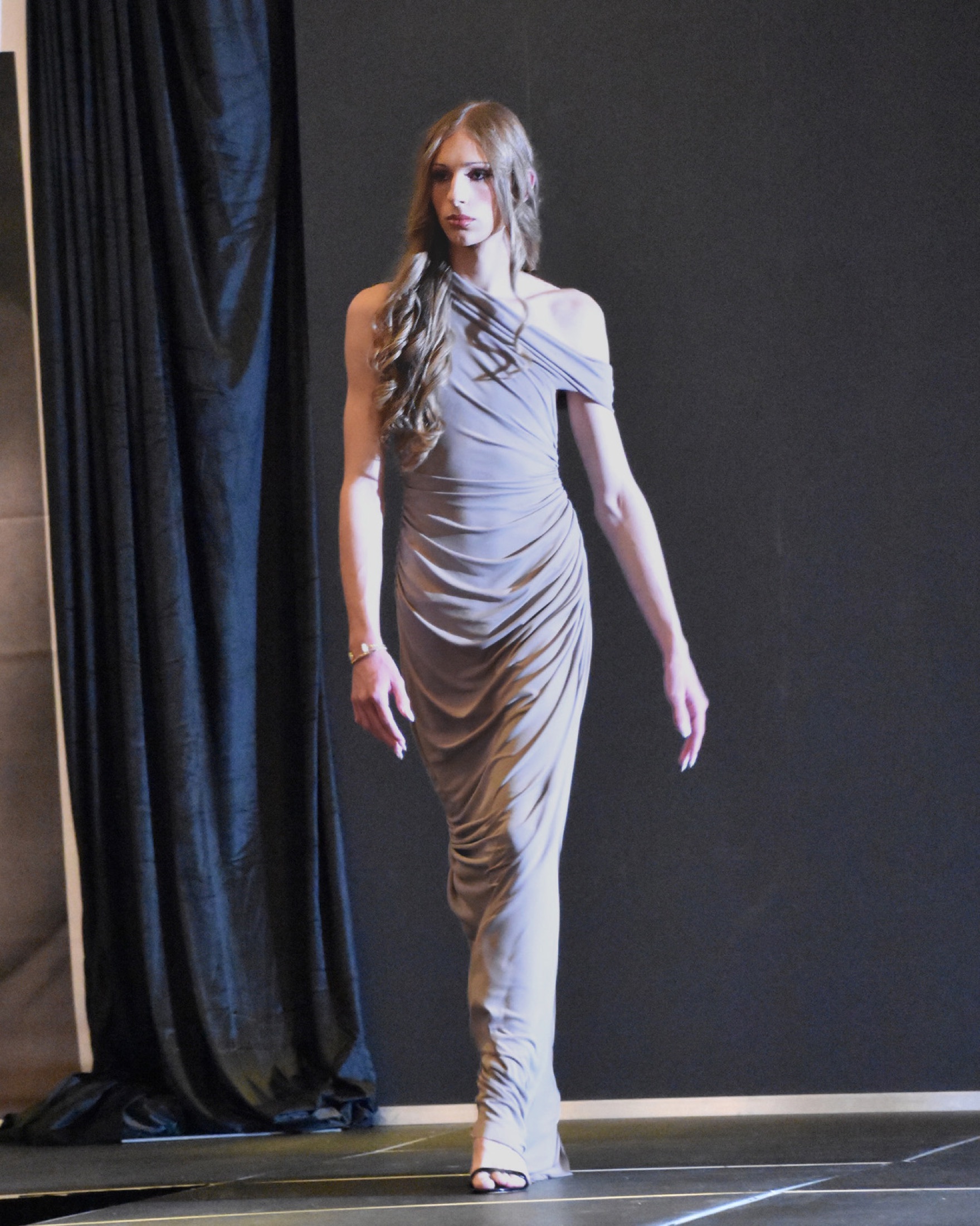 Runway walk in a VeeJay Floresca look
