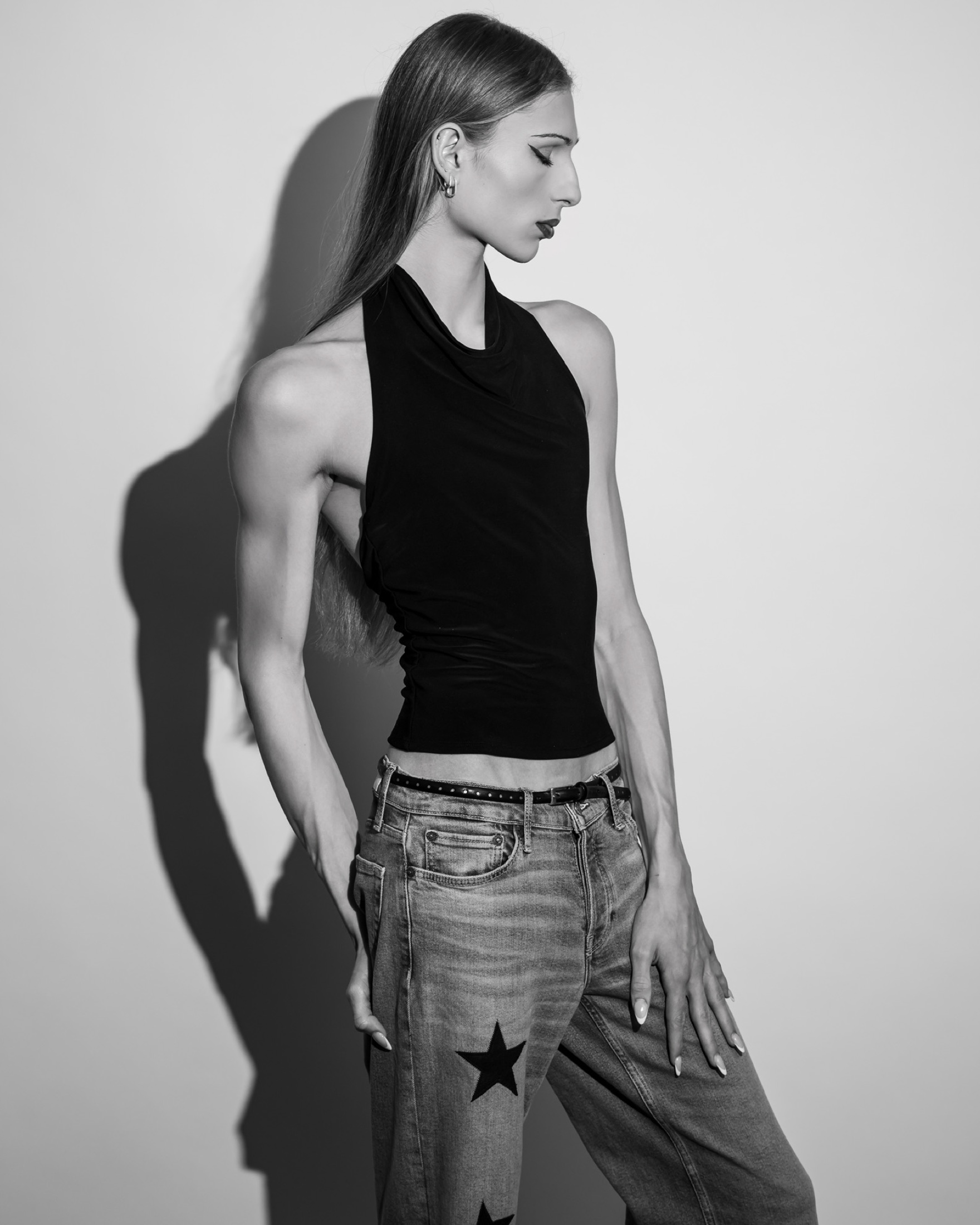 Black-and-white profile editorial portrait